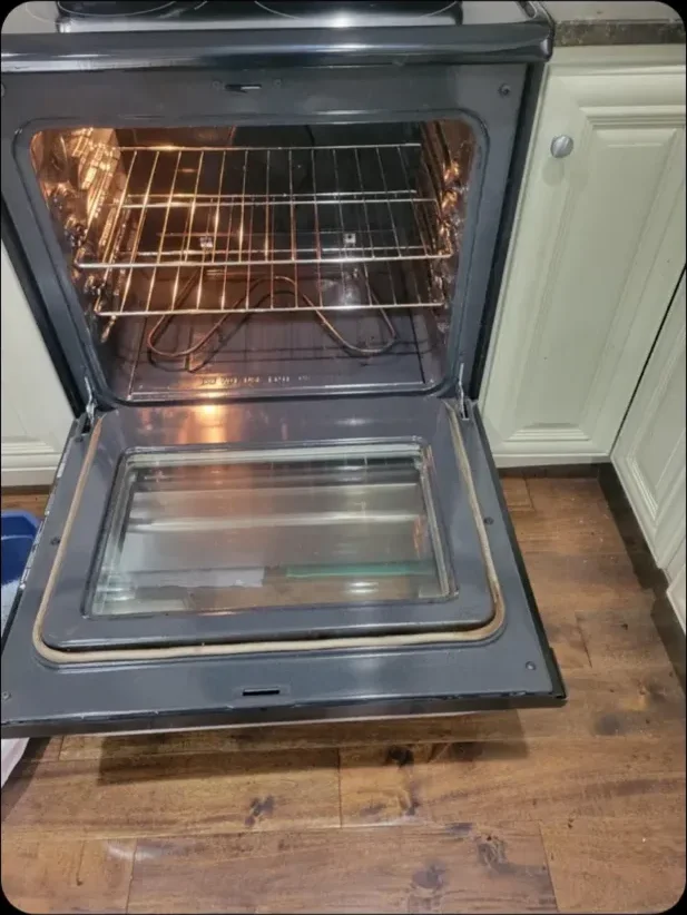 The same oven interior after a Happy Maids move-out clean