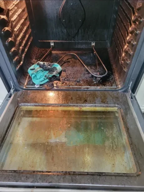 Oven interior before a Happy Maids move-out clean